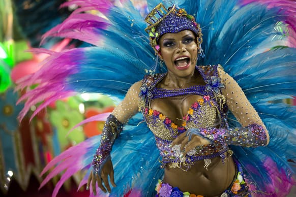 A performer from the Unidos de Vila Isabel samba school parades during Carnival celebrations at the Sambadrome in Rio de Janeiro.