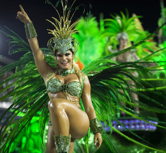 A performer from the Unidos de Vila Isabel samba school parades during Carnival celebrations at the Sambadrome in Rio de Janeiro.