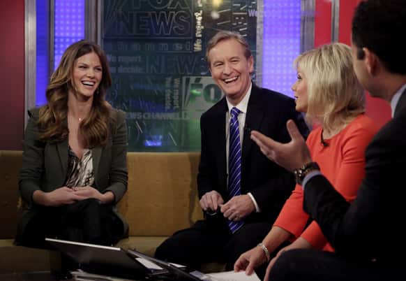 Model and actress Brooklyn Decker, left, is interviewed by co-hosts Steve Doocy, second left, Gretchen Carlson, and Brian Kilmeade during her appearance on the on the