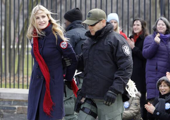 Actress Daryl Hannah is arrested outside the White House in Washington, as prominent environmental leaders tied themselves to the White House gate to protest the Keystone XL oil pipeline.