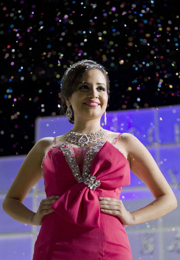 Magdabelyn Parra Gamez, who goes by Belyn, looks out at the crowd after being named the winner of the