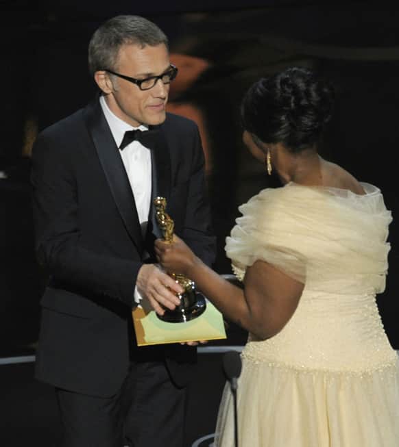 Actress Octavia Spencer, right, presents the award for best actor in a supporting role for