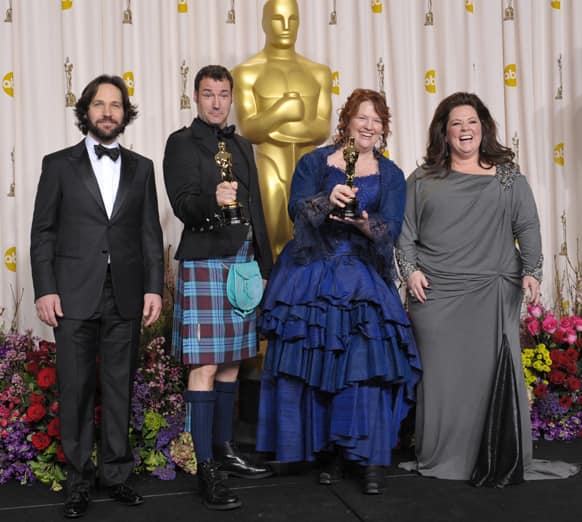 Presenter Paul Rudd, from left, director Mark Andrews, Brenda Chapman, and Melissa McCarthy pose with their award for best animated feature film for