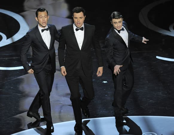 Actors, from left, Joseph Gordon-Levitt, host Seth MacFarlane and Daniel Radcliffe perform during the Oscars at the Dolby Theatre.