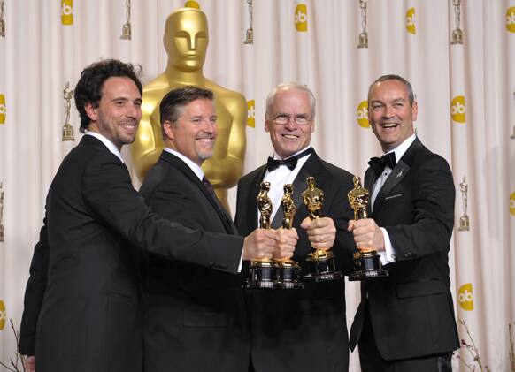 Guillaume Rocheron, from left, Bill Westenhofer, Donald R. Elliott, and Erik-Jan De Boer pose with their award for best visual effects for