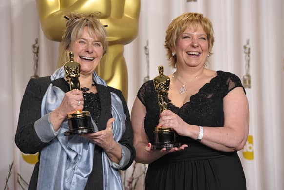 Julie Dartnell, left, and Lisa Westcott pose with their award for best makeup and hairstyling for