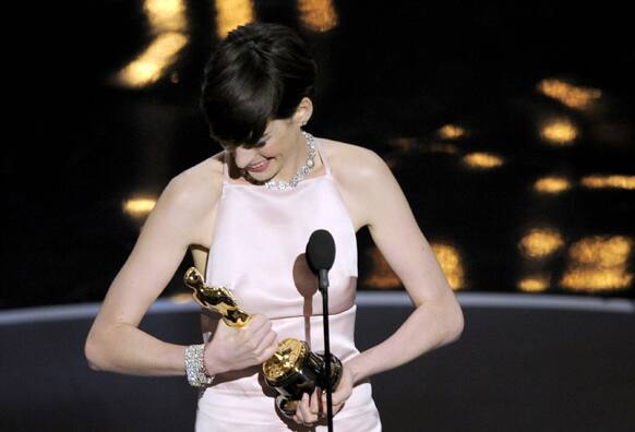 Anne Hathaway accepts the award for best actress in a supporting role for
