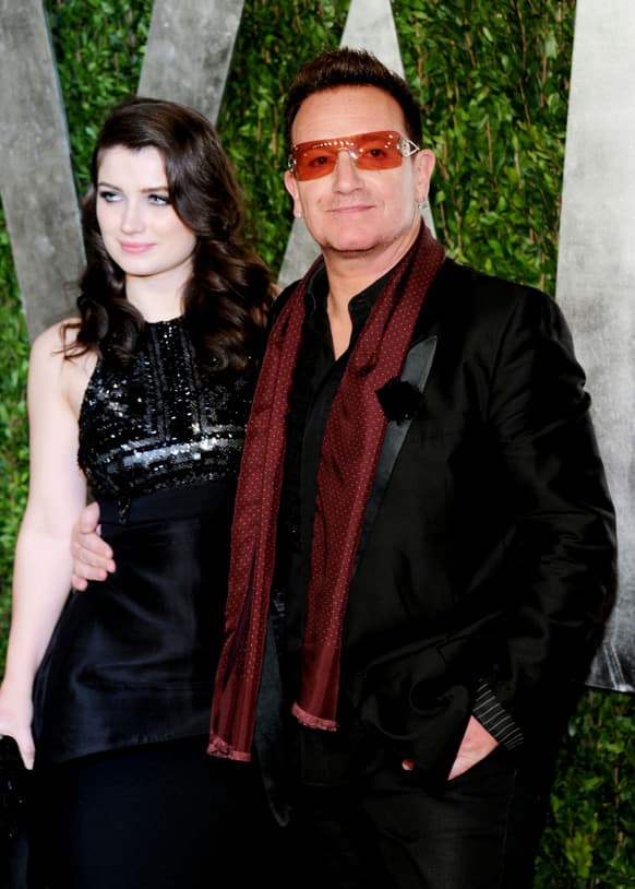 Musician, Bono, right, and his wife Ali Hewson arrive at the 2013 Vanity Fair Oscars Viewing and After Party, at the Sunset Plaza Hotel in West Hollywood, Calif.