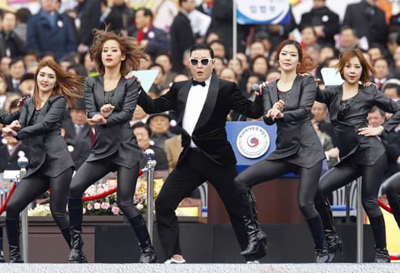 Singer Psy, center, performs during the inauguration of South Korea's President Park Geun-hye, not pictured, at parliament in Seoul, South Korea.