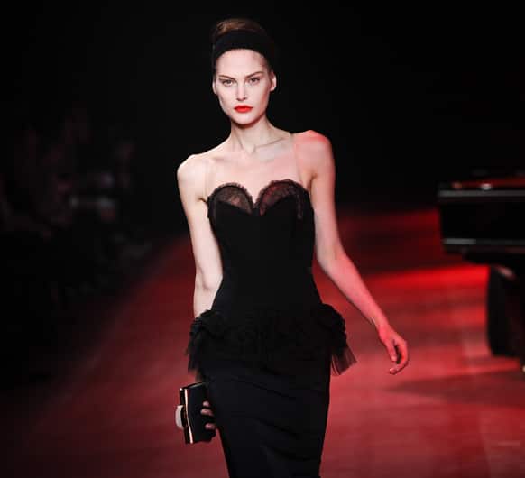 A model presents a creation by fashion designer Peter Copping as part of the Nina Ricci Ready to Wear's Fall-Winter 2013-2014 fashion collection, presented, in Paris.