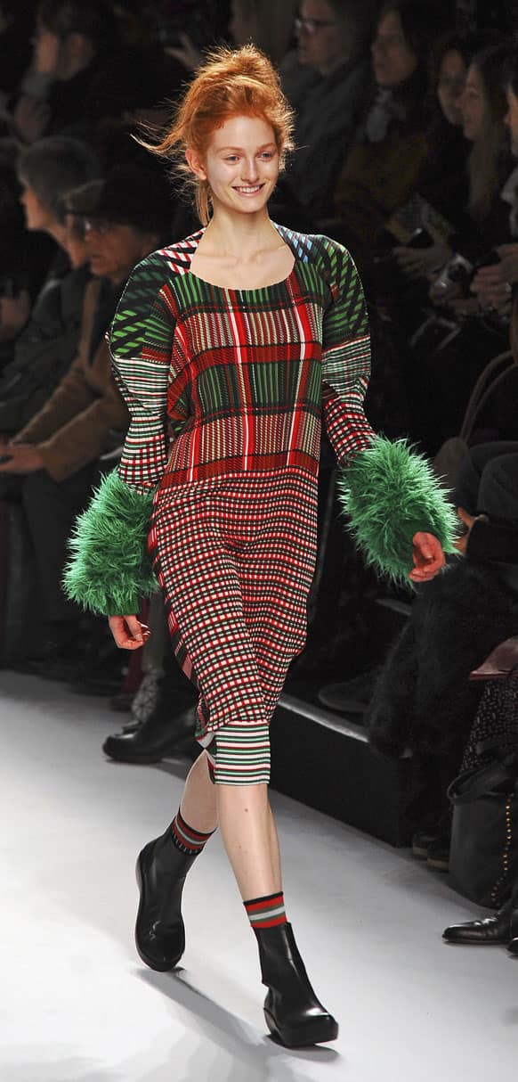 A model wears a creation by fashion house Issey Miyake during the presentation of its Fall/Winter 2013-2014 ready to wear collection in Paris.