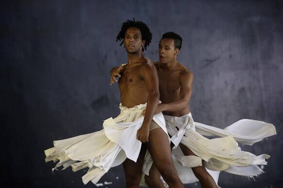 Dancers from the Afro Reggae center perform before members of London's Royal Opera House in the Vigario Geral slum in Rio de Janeiro, Brazil.