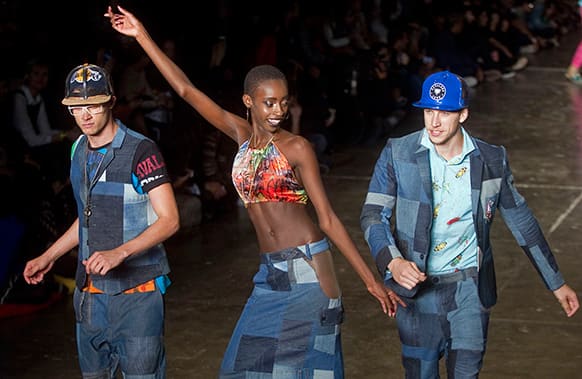 Models dance as they present creations from the Cavalera summer collection during the Sao Paulo Fashion Week.