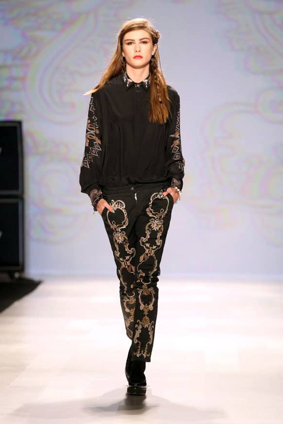 A model wears a creation from Chloe comme Parris while walking the runway during Toronto Fashion Week in Toronto.