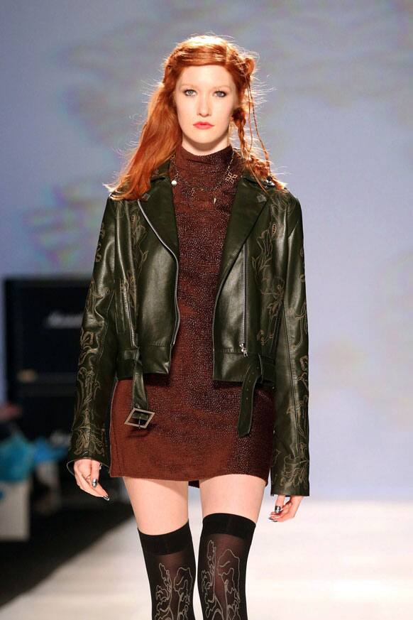A model wears a creation from Chloe comme Parris while walking the runway during Toronto Fashion Week in Toronto.