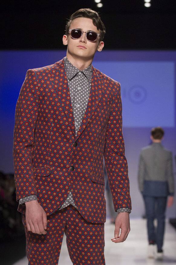A model wears a creation from Bustle while walking the runway during Toronto Fashion Week in Toronto.