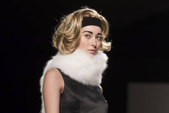 A model shows a creation from Pink Tartan while walking the runway during Toronto Fashion Week in Toronto.