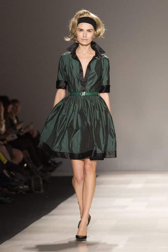 A model shows a creation from Pink Tartan while walking the runway during Toronto Fashion Week in Toronto.