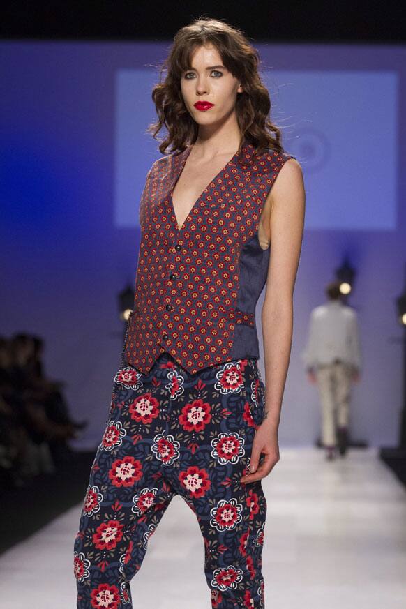 A model wears a creation from Bustle while walking the runway during Toronto Fashion Week in Toronto.