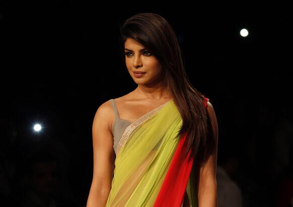 Bollywood Actress Priyanka Chopra showcases a creation of Manish Malhotra during the first day of Lakme fashion week, Mumbai.