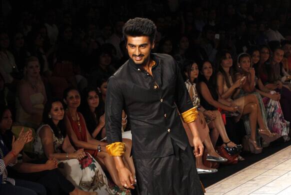 Bollywood actor Arjun Kapoor displays a creation by Kunal Rawal during the Lakme fashion week in Mumbai.