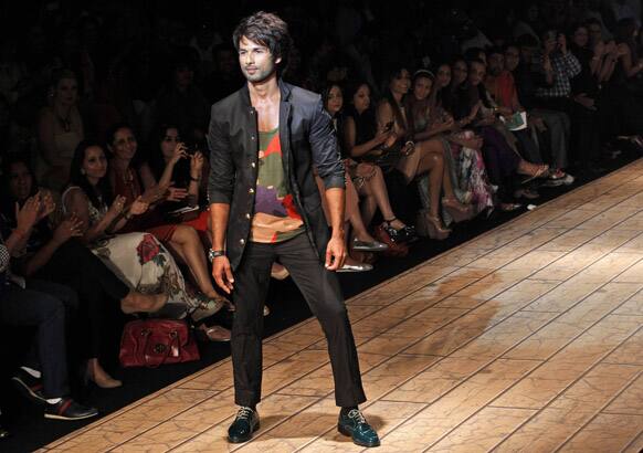 Bollywood actor Shahid Kapoor displays a creation by Kunal Rawal during the Lakme fashion week in Mumbai.