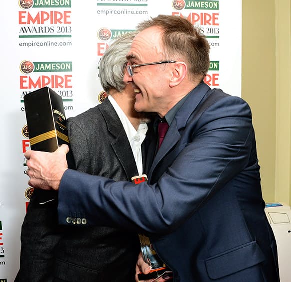 Directors Danny Boyle, right, and Sam Mendes hug at the Jameson Empire Film Awards 2013, at Grosvenor House in London.