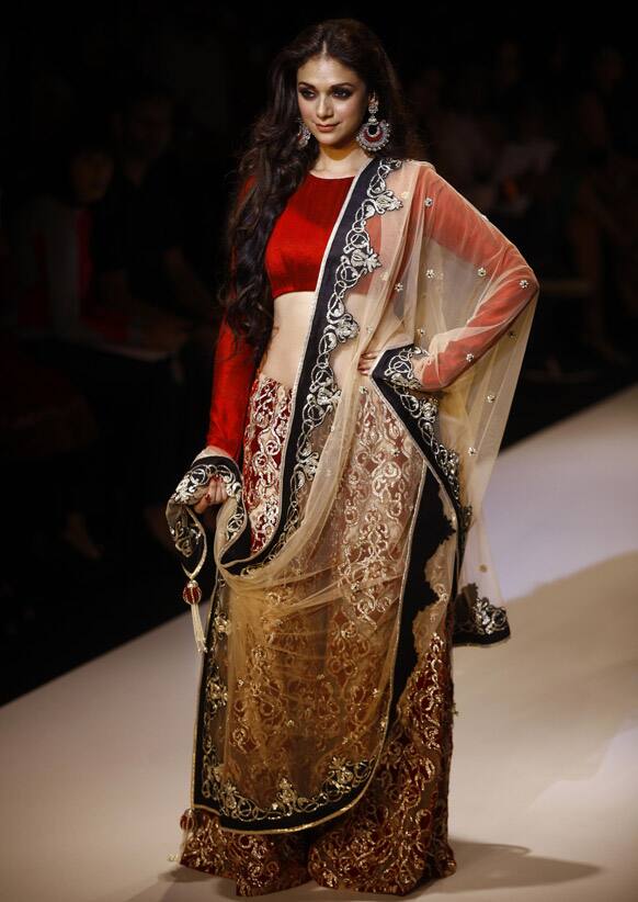 Bollywood actress Aditi Rao Hydari displays a creation by Payal Singha during the Lakme Fashion Week in Mumbai.