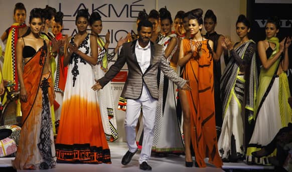 Indian choreographer and actor Prabhu Deva displays a creation by Archana Kochhar during the Lakme Fashion Week in Mumbai.