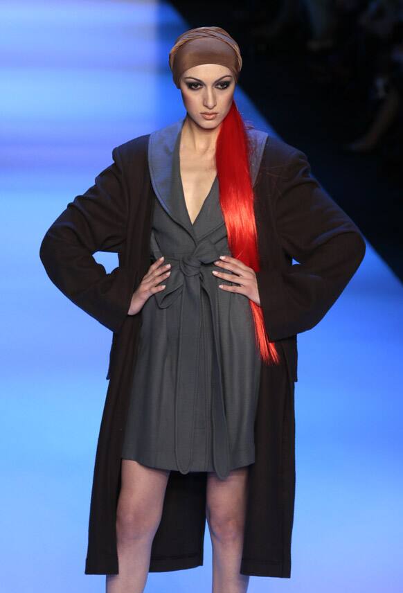 A model displays a creation by Georgian designer Goga Nikabadze during Moscow Fashion Week, Russia.
