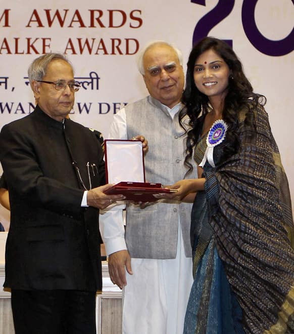 Usha Jadhav receives the Best Actress award from Indian President Pranab Mukherjee during the National Film Awards 2012, in New Delhi.