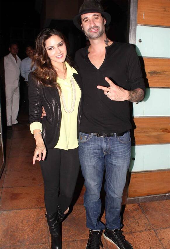 Sunny Leone and her husband Daniel Weber pose for a photograph at the success bash of 'Shootout At Wadala'.