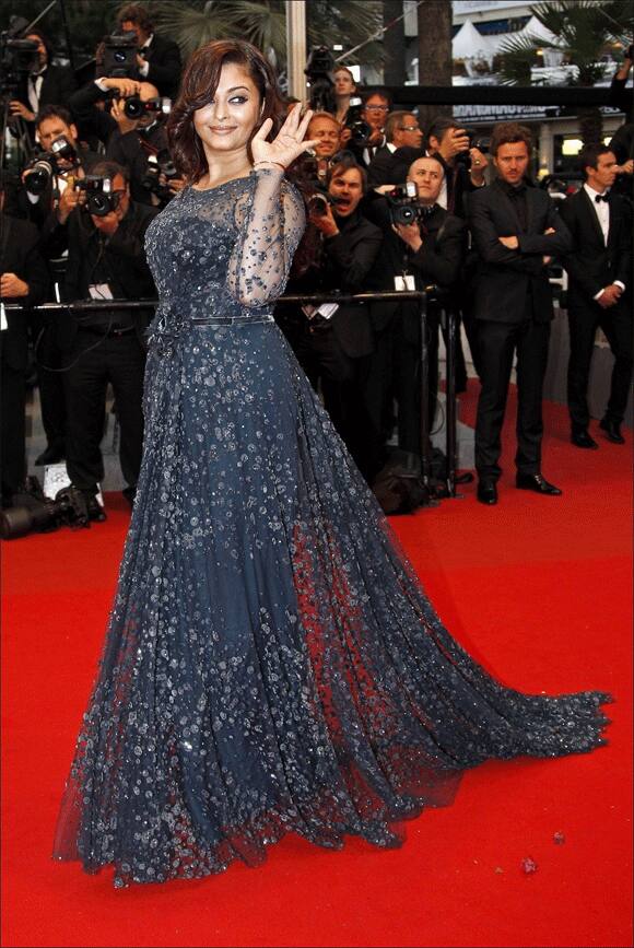 Aishwarya Rai, who was criticized for her post pregnancy weight gain, walked down the red carpet in a figure hugging Elie Saab with confidence.