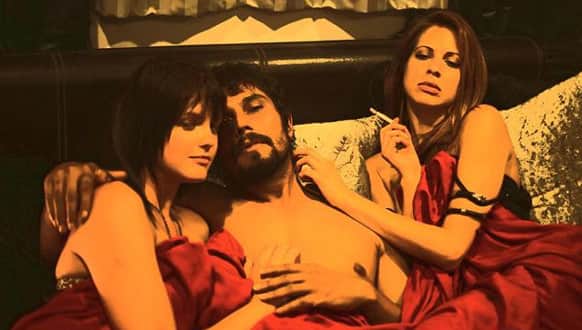 Randeep Hooda poses with two scantily clad women in the opening shot of 'Bad'. Produced by Pooja Bhatt, the film would be based on the life of Charles Sobhraj.