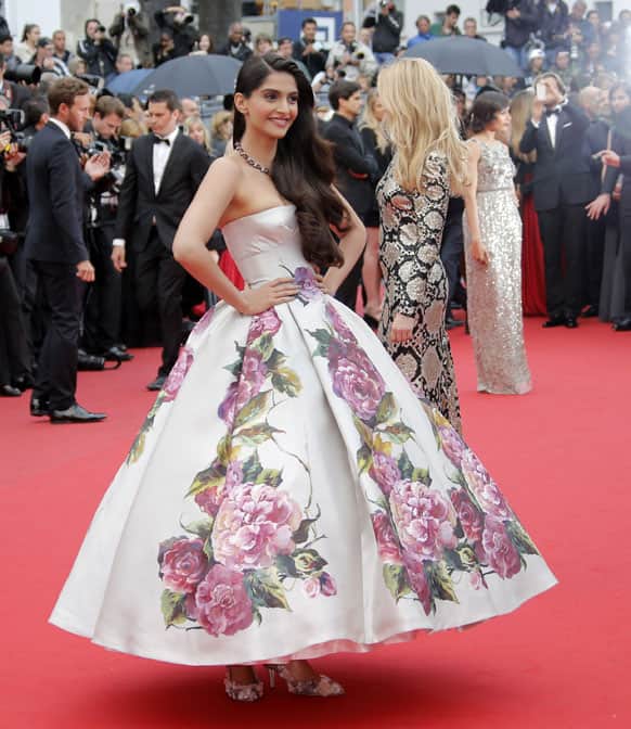 Sonam Kapoor poses for photographers as she arrives for the screening of Young & Beautiful at the 66th international film festival, in Cannes.