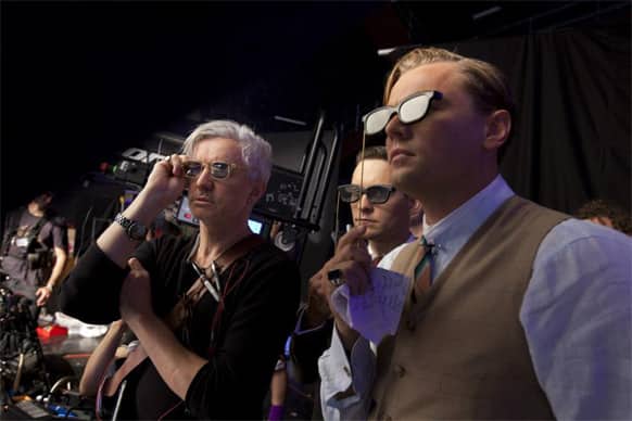 Director Baz Luhrman, Tobey McGuire and Leonardo DiCaprio catch a glimpse of 'The Great Gatsby' through their 3-D glasses. The film released May 17.
