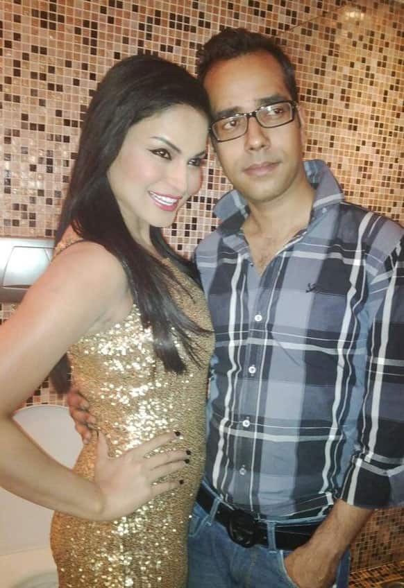 Veena Malik poses with her very dear designer friend Ashfaque Ahmad. She is wearing the dress designed by him.