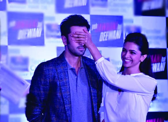 Ranbir Kapoor and Deepika Padukone in a playful snap at an event for the promotion of 'Yeh Jawaani Hai Deewani'.