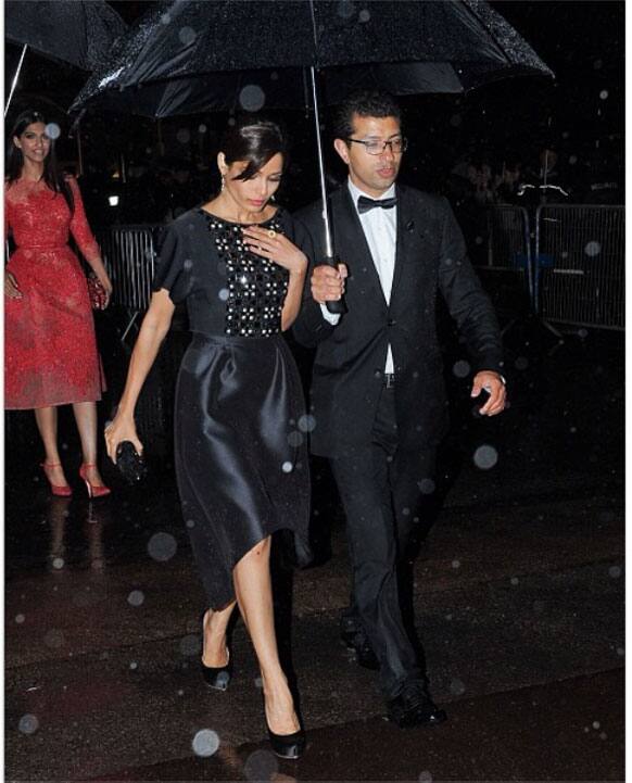 Freida Pinto is seen in thic picture at the after party of 'The Great Gatsby' in Cannes. There is Sonam Kapoor too walking behind her.