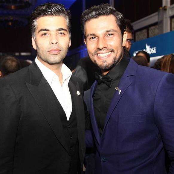 Karan Johar and Randeep Hooda pose for a photograph at the GQ Best Dressed Men 2013 event.