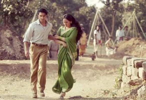 Sonakshi is being forcibly escorted by Ranveer in this still from 'Lootera'.