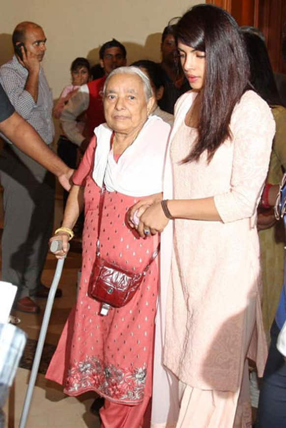 Priyanka Chopra is seen here with an elderly member of her family at her father's prayer meeting.