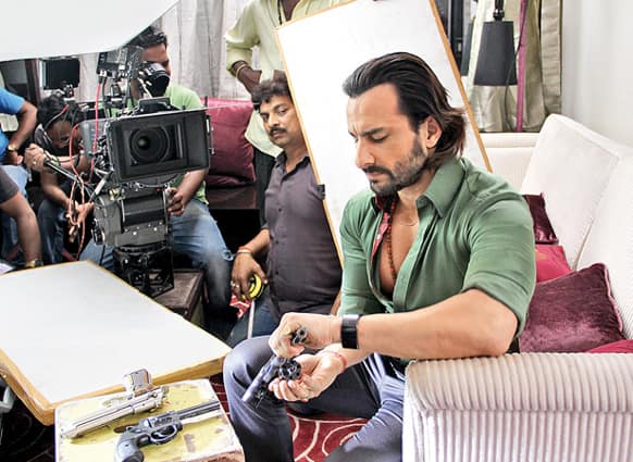 Saif Ali Khan plays around with his toys on the sets of ‘Bullet Raja’. Image Courtesy: Filmfare