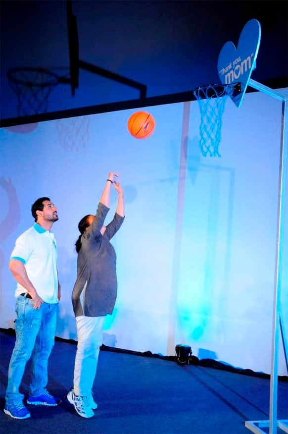 John Abraham looks on as his mother scores a basket - at the 'Thank You mom' initiative by P&G.