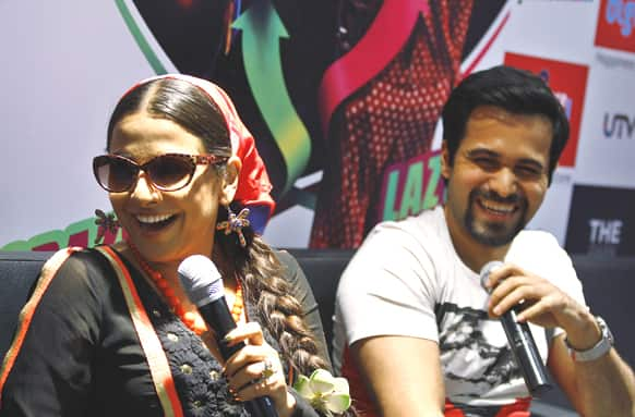 Bollywood actors Vidya Balan, left, and Emran Hashmi laugh during a promotional event of her forthcoming movie 