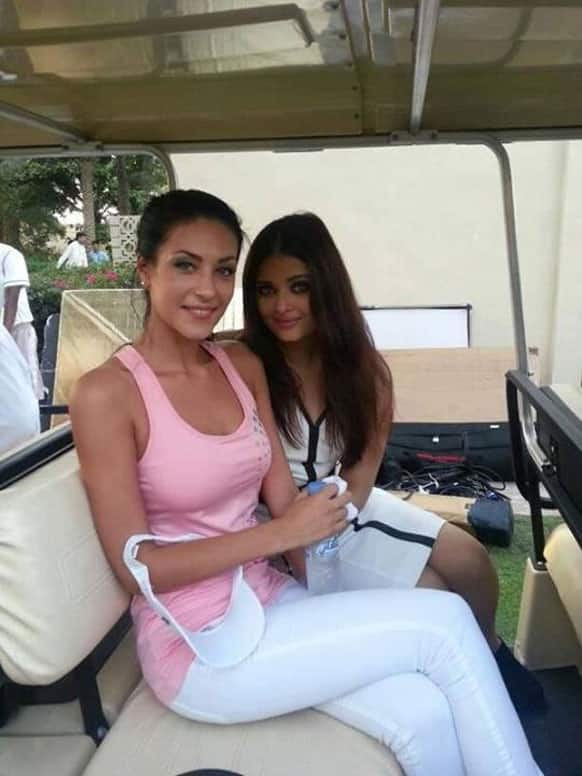 Aishwarya Rai Bachchan poses with a model on the sets of a photoshoot in Dubai.