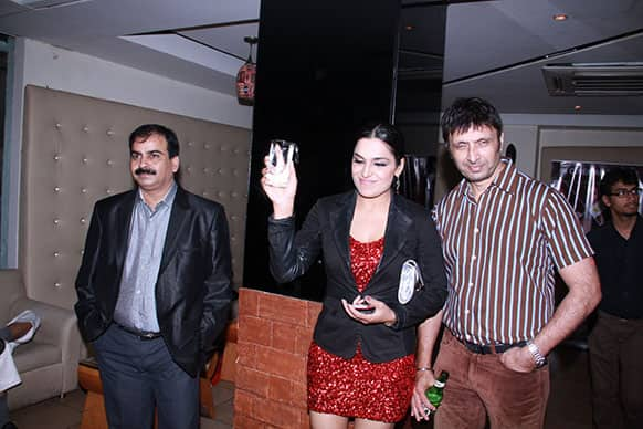 Director Ajay Yadav (left), Meera and Shiva at the pre-release party.