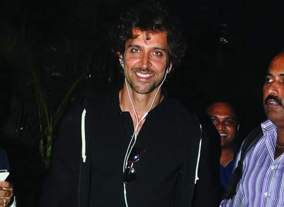 Hrithik Roshan smiles at the camera while on his way back from Hyderabad after unveiling the digital motion poster of 'Krrish 3'.