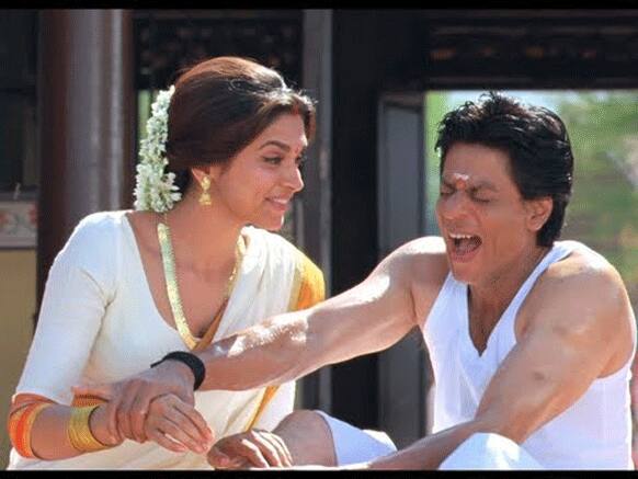 Wife Deepika attending to hubby SRK's aching leg.