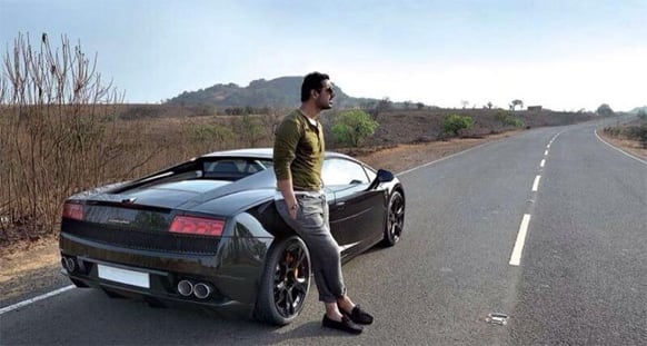 That's John Abraham with his beast - a Lamborghini.